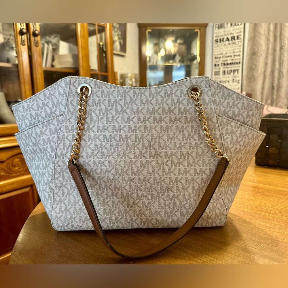 Michael Kors Purse with gold bag tag gently used
